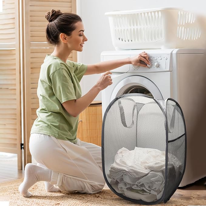 The upgraded pop-up laundry basket features a breathable side pocket mesh design