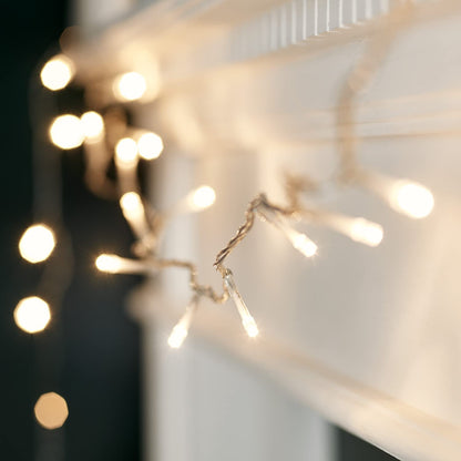 Lights4fun 8m String Lights 100 LED Warm White Fairy Lights Clear Cable with Rocker Switch Plug in Mains Powered Remote Control and Timer Indoor Bedroom Party Wedding Decoration