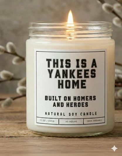 This is a Yankees Home - Built on Homers and Heroes Candle - Scented Soy Wax Candle (8.0 oz) 50-60 Hour Burn Time, Cotton Wick, Frosted White Glass Jar