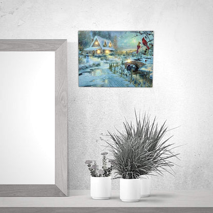 BANBERRY DESIGNS LED Christmas Wall Art - Lighted Cottage Along a Stream Christmas Scene with Cardinals and Snowman - LED Canvas Prints - Old Fashioned Cobblestone Bridge - Measures 11.75" x15.75"
