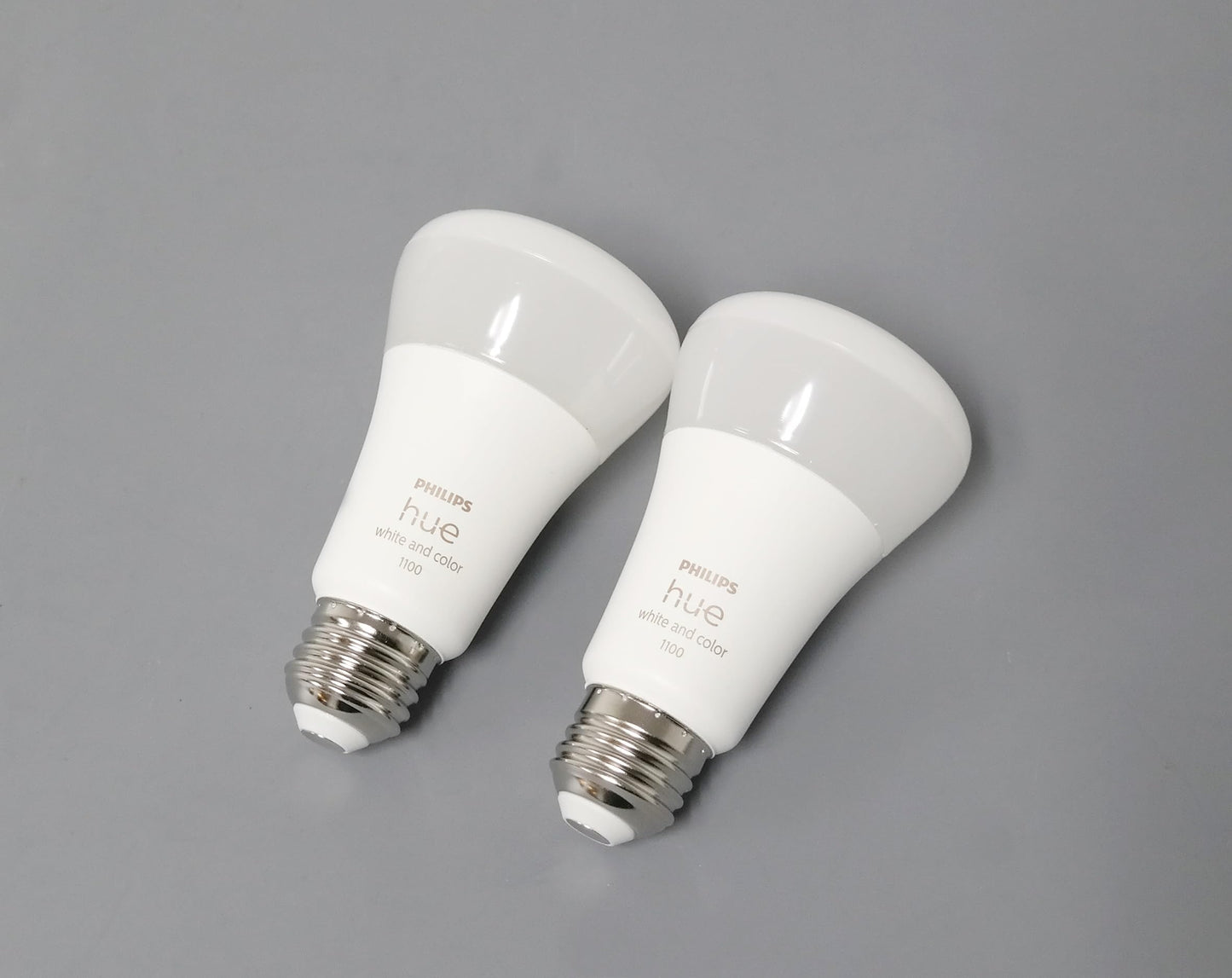 Philips Hue Smart Light Bulbs Starter Kit, Includes (1) Bridge, (2) 60W A19 Bulbs, White and Color Ambiance LED Color Changing Lights, 800LM, E26, Control with App or Voice Assistant