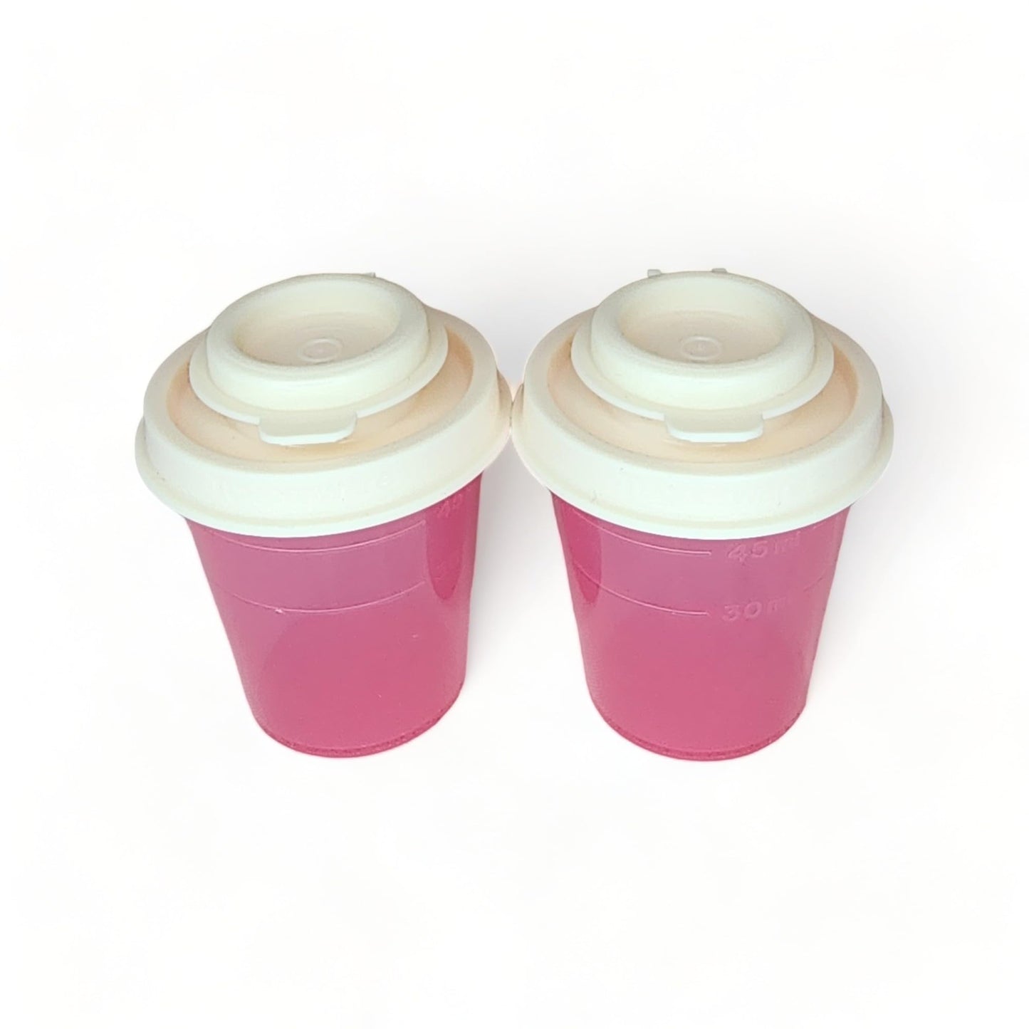 Tupperware Mini Salt and Pepper Shakers 2 oz Pink with Cream Lids