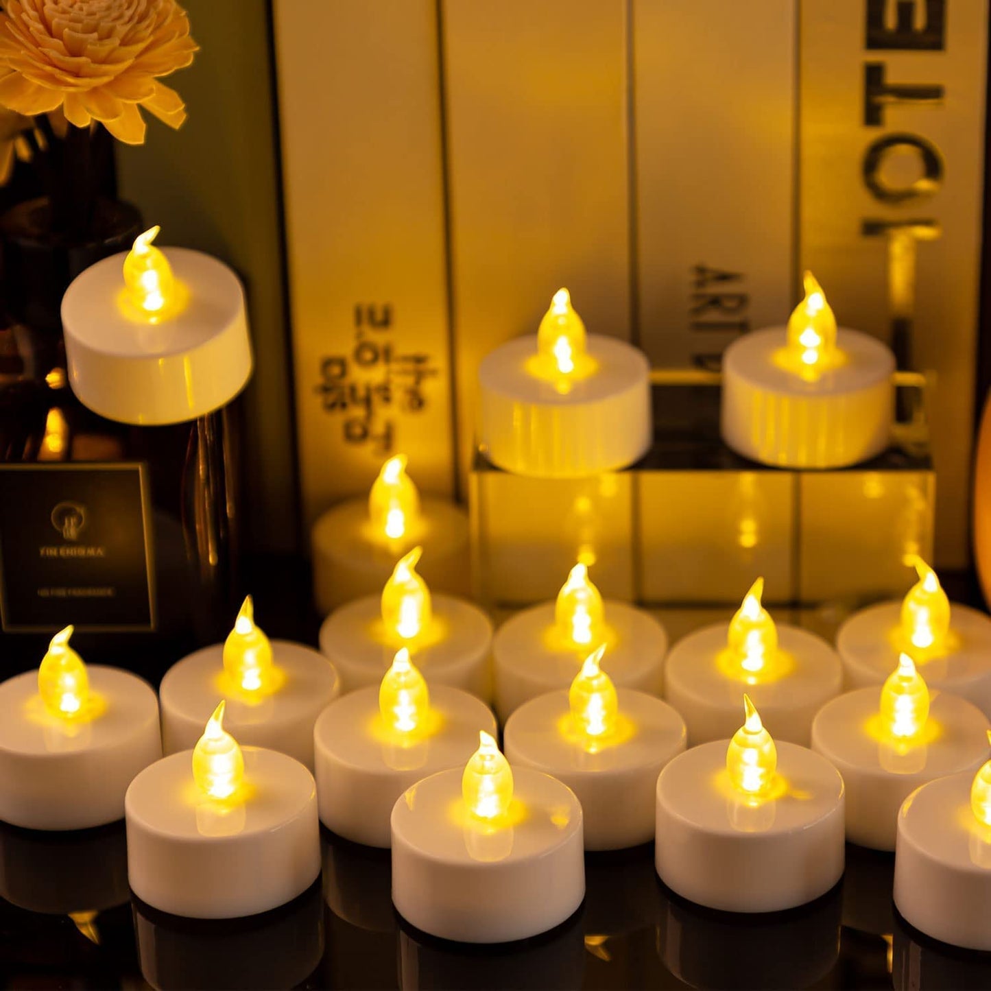 Hanzim LED Tea Lights Candles- 100PACK Warm Yellow Flameless Candles Realistic and Bright Flickering Long Lasting 200Hours for Holiday Celebration,Party,Home Decoration,Battery Operated