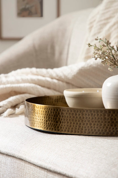 Kate and Laurel Samana Modern Glam Round Metal Tray; 17 Inch Diameter; Antique Brass; Circular Polished Decorative Tray with Hammered Surface and Minimalist Handles