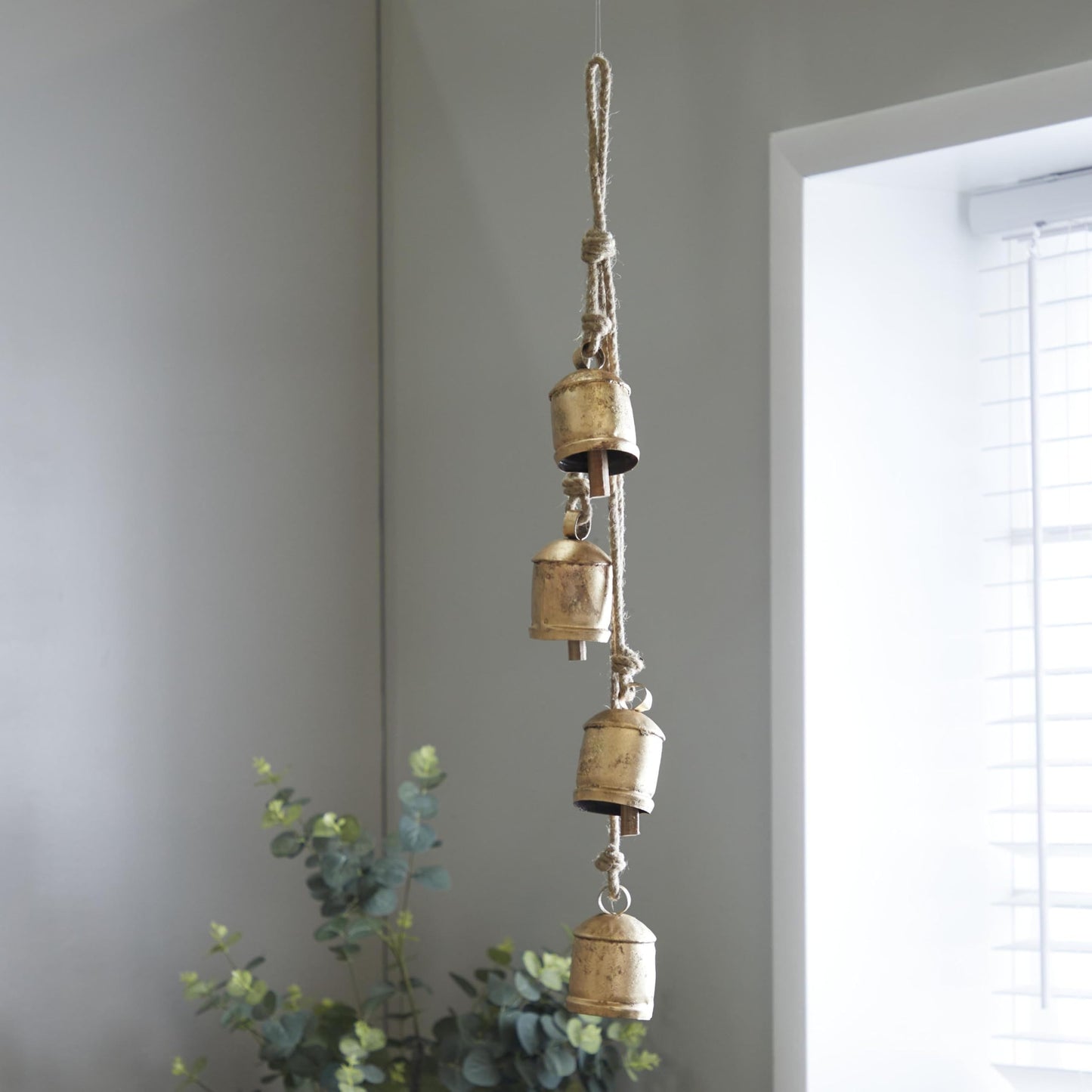 Deco 79 Metal Indoor Outdoor Decorative Cow Bells Tibetan Inspired Cascading Meditation Bell with 4 Bells on Jute Hanging Rope, Cow Bell 3" x 3" x 27", Gold