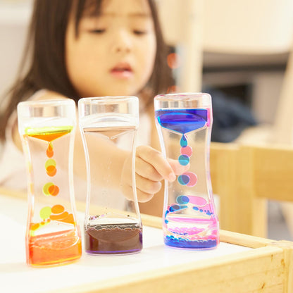 THE TWIDDLERS 5 Liquid Motion Timers Sensory Timer Hourglasses - 14cm, 5 Colours - Kids Water Bubble Lava Lamp Calming Sensory Toys for Autism, Stress Relief, Relaxation, ADHD