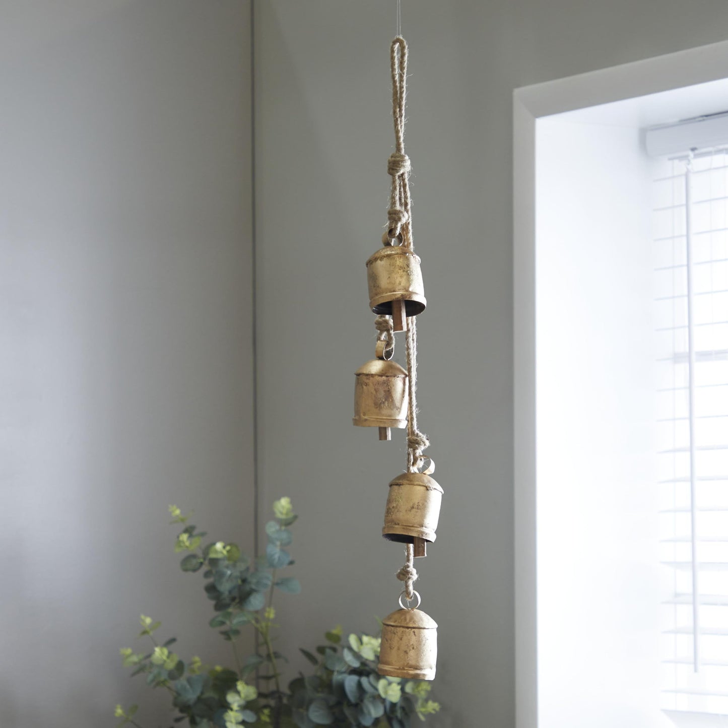 Deco 79 Metal Indoor Outdoor Decorative Cow Bells Tibetan Inspired Cascading Meditation Bell with 4 Bells on Jute Hanging Rope, Cow Bell 3" x 3" x 27", Gold