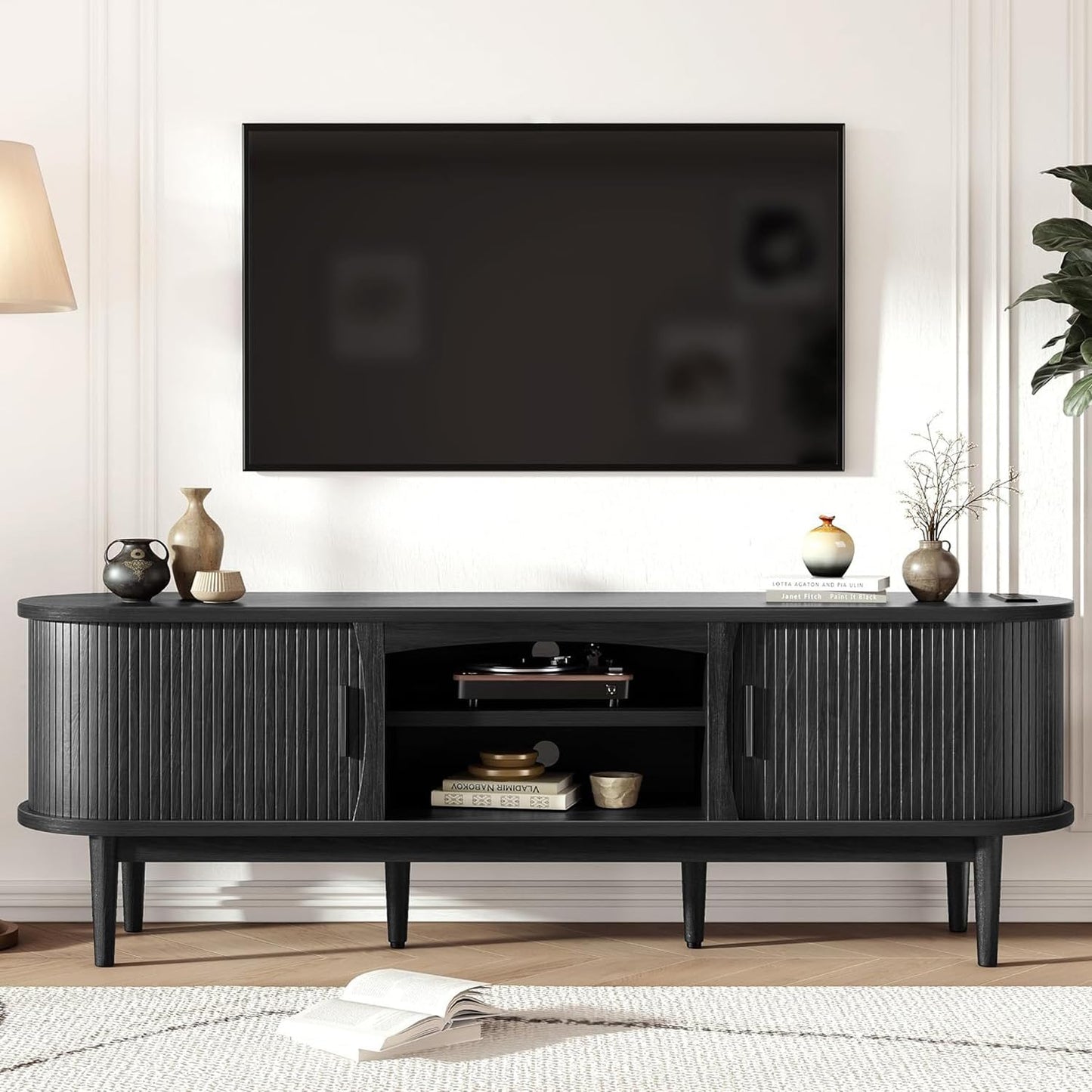 Decofy Mid Century TV Stand for TVs up to 80 Inches, Entertainment Center with Storage, Power Outlet, Fluted Sliding Doors & Adjustable Shelves, Modern Media TV Console Table for Living Room (Black)