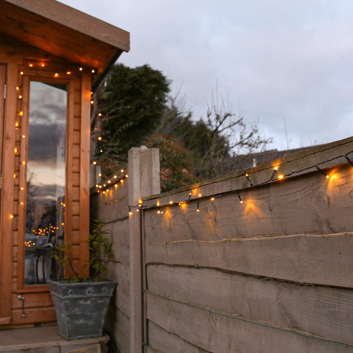 Festive Lights - 10m Solar Power Multi Function Fairy String Lights with 100 Warm White LEDs - IP44 Rated, Outdoor Decorative Lighting - External Panel, Black Cable, Garden Trees, Fences & Pergolas