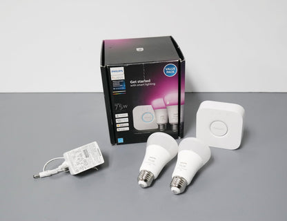 Philips Hue Smart Light Bulbs Starter Kit, Includes (1) Bridge, (2) 60W A19 Bulbs, White and Color Ambiance LED Color Changing Lights, 800LM, E26, Control with App or Voice Assistant