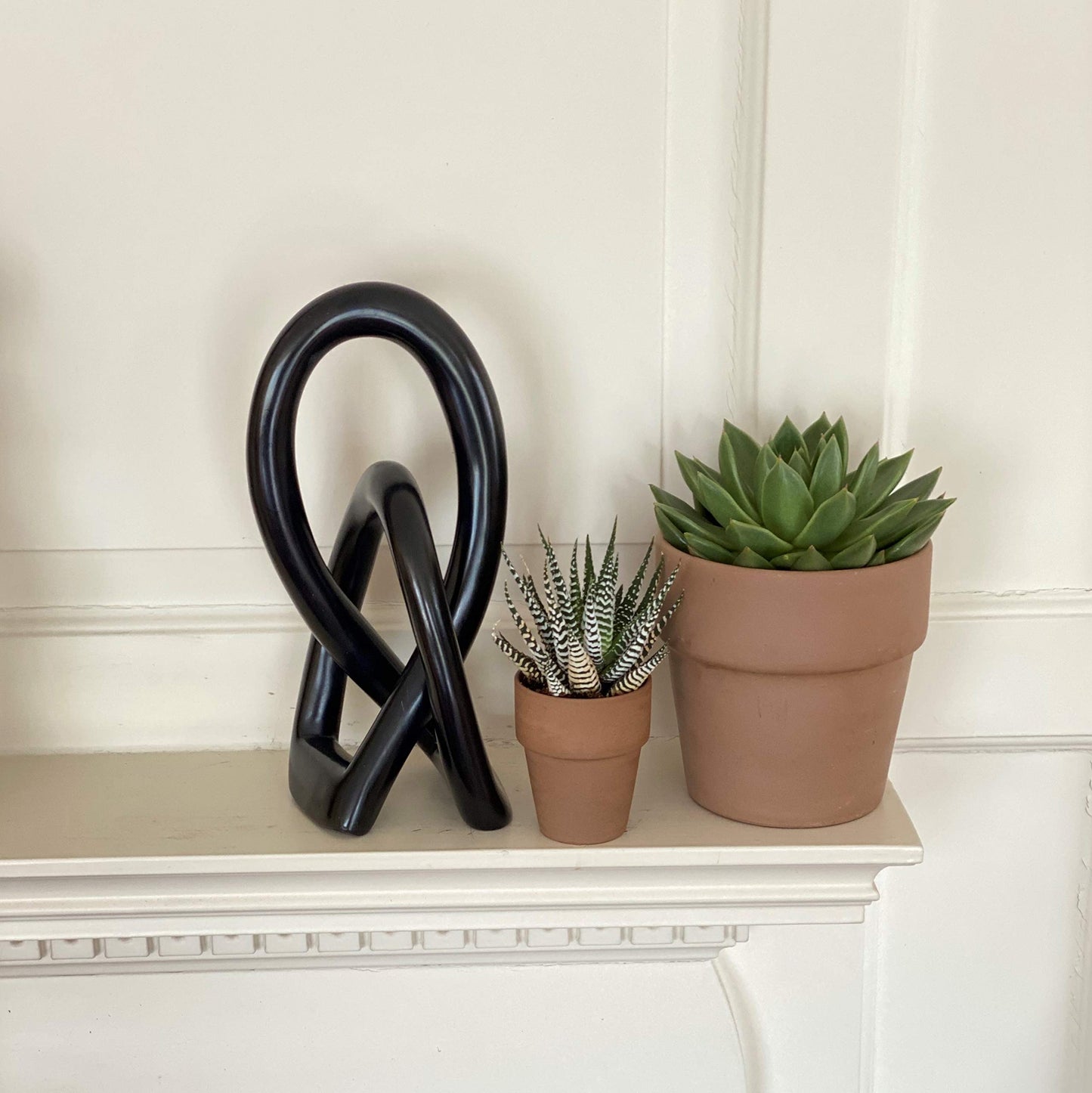 Global Crafts - Soapstone Lovers Knot Sculpture - 10 in Black
