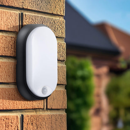 Luceco Eco Outdoor LED Bulkhead Light with PIR Motion Sensor, Decorative Exterior Lighting, Oval, Black, IP54, 10W, 700lm, 4000K, EBEO10P40