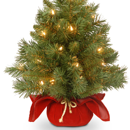National Tree Company 24 in Pre-Lit Majestic Fir Mini Artificial Christmas Tree, 35 Clear Lights, 71 Tips, Red Cloth Base, Green