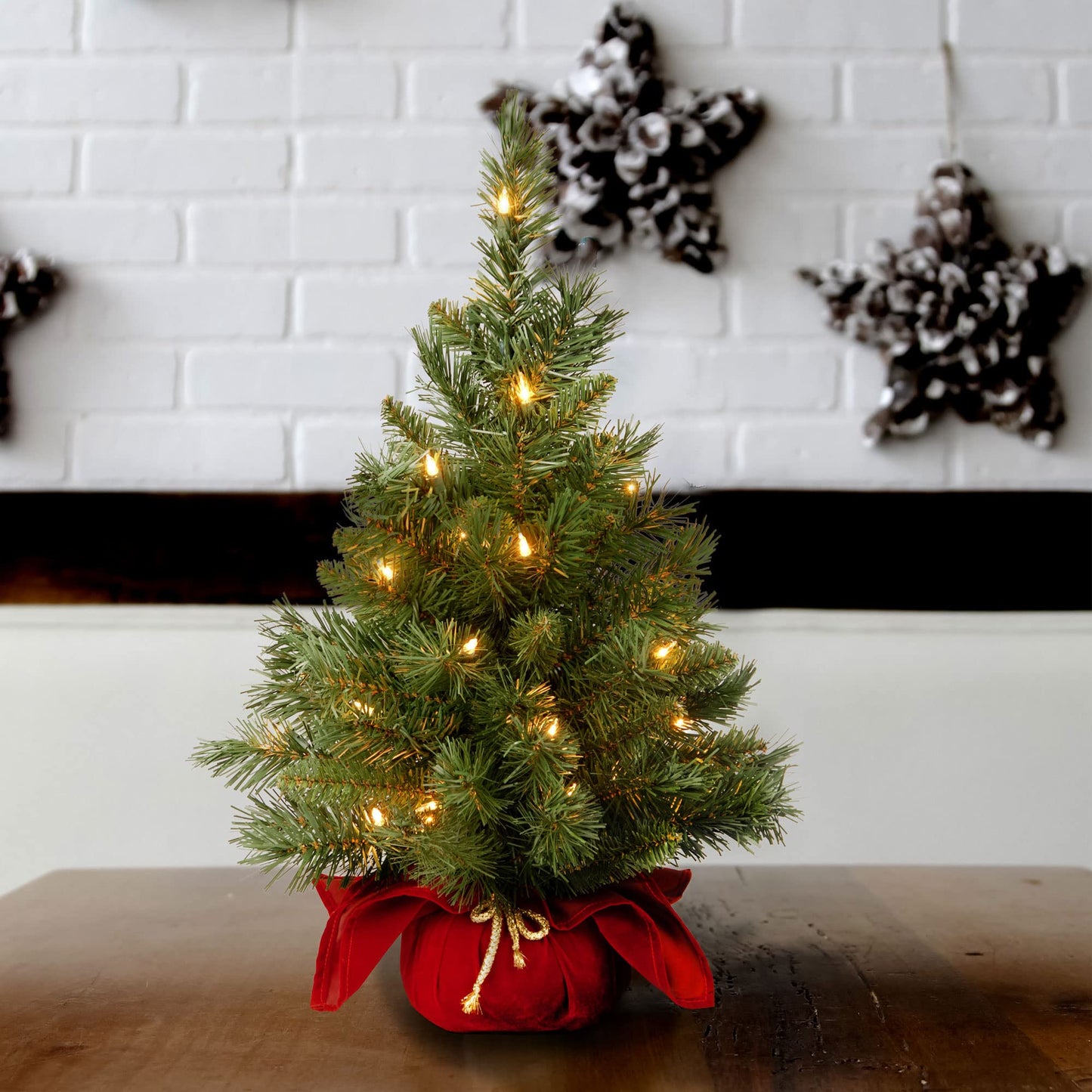 National Tree Company 24 in Pre-Lit Majestic Fir Mini Artificial Christmas Tree, 35 Clear Lights, 71 Tips, Red Cloth Base, Green