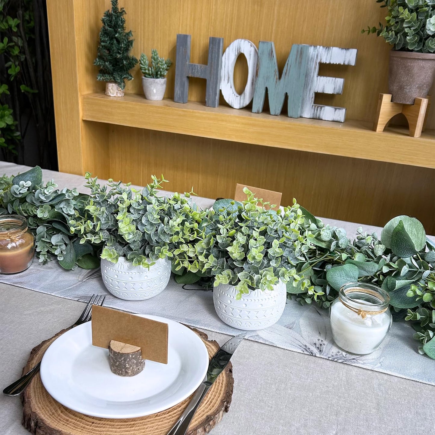 Winlyn Set of 2 Small Artificial Potted Plants Faux Eucalyptus Plant in White Geometric Ceramic Pots Small Desk Potted Plants 7.1" Tall for Home Office Room Decorations Wedding Greenery Centerpiece