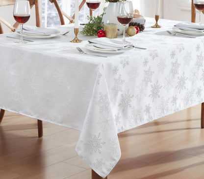 Newbridge Fancy Metallic Snowflake Christmas Fabric Tablecloth, 60 x 84 Inch Rectangle, White Silver, No-Iron Soil Resistant Sparkling Snowflakes Woven Holiday Table Cover
