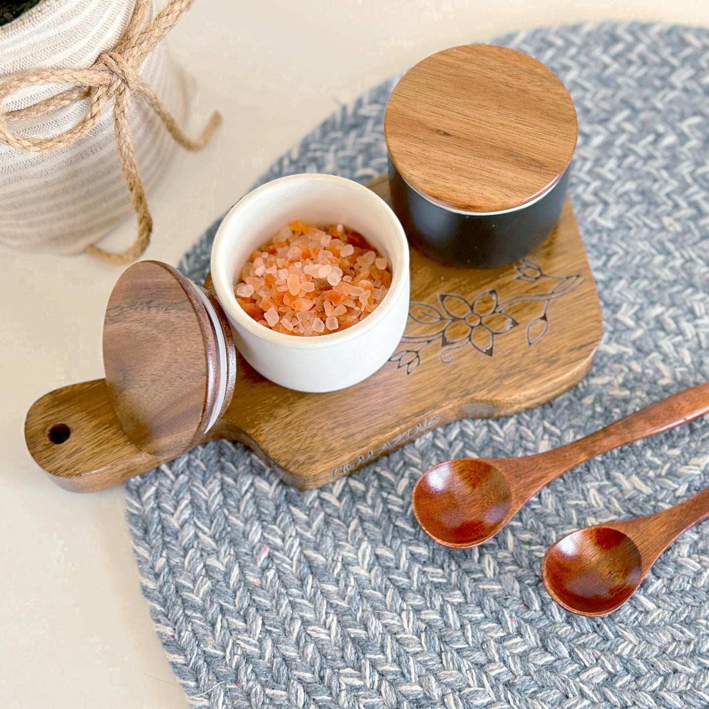 UhMAZING SALT AND PEPPER CELLAR SET WITH ACACIA WOOD LID AND ENGRAVED DECORATIVE HOLDING TRAY - WHITE AND BLACK