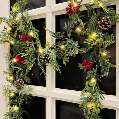MINDELF 6 FT Artificial Christmas Garland, Faux Cypress Leaf Evergreen Garland with 20 LED Lights, Red Berries and Pinecones, Green-Yellow Leaves, Timer, Perfect for Indoor Outdoor Window Mantel
