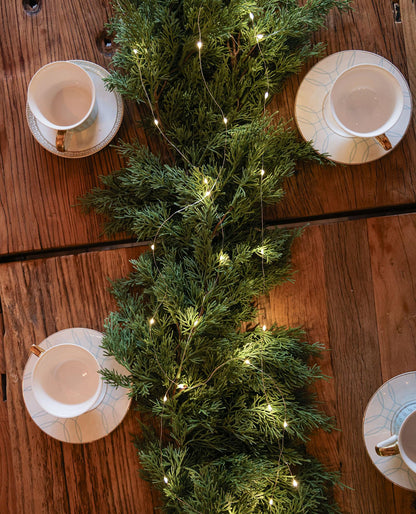 6FT Christmas Garland PARTY JOY Cedar Garland with 9.8FT LED String Lights, Greenery Plant for Christmas Decorations Table Mantle Background Wall Room Outdoor Indoor Winter Decoration